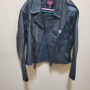Vintage Genuine Leather jacket with silver color conchos and intact fringe.